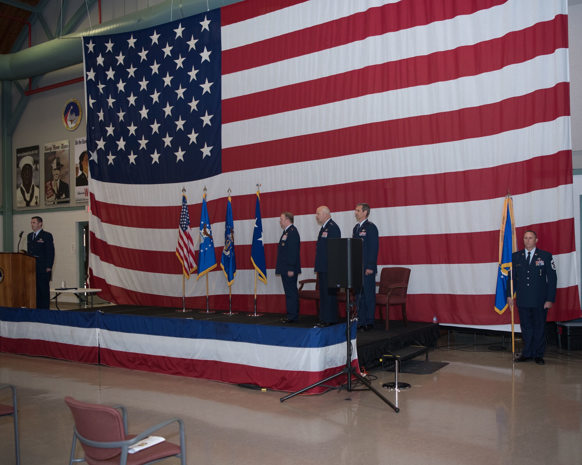 Lt. Gen. Richard Scobee, Chief of the Air Force Reserve and Commander Air Force Reserve Command, Maj. Gen. Brian Borgen, Commander Tenth Air Force (outgoing) and Maj. Gen. Bryan Radliff, Commander Tenth Air Force (incoming), stand at attention as the Dyess Honor Guard exits after presenting the colors.