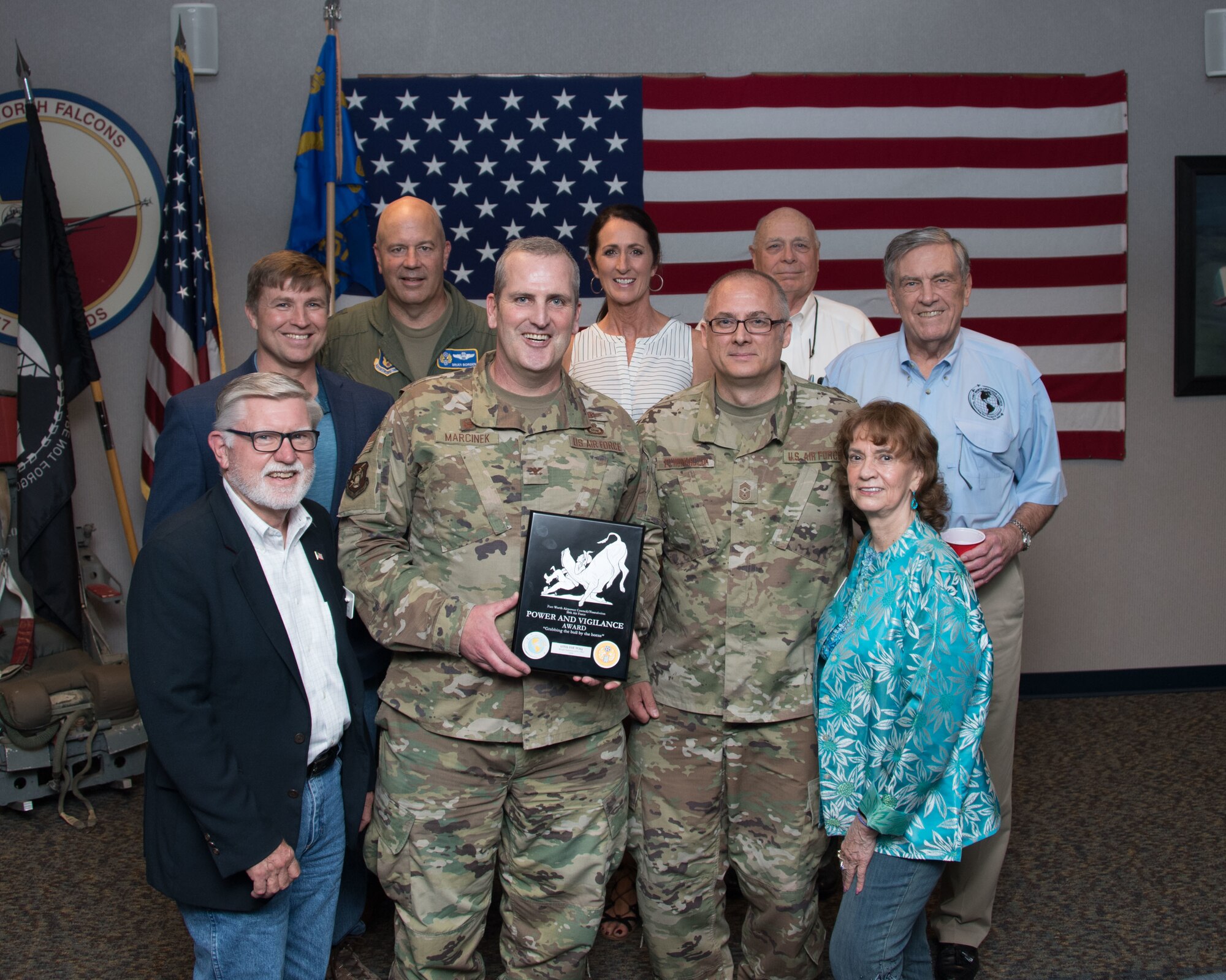 Maj. Gen. Brian Borgen, Tenth Air Force Commander and Chief Master Sgt. Jeremy Malcom, Tenth Air Force Command Chief, present the Power and Vigilance Award to Col. Joseph Marcinek, 655th Intelligence, Surveillance, and Reconnaissance Wing Commander and Chief Master Sgt. Bohdan Pywowarczuk II, 655th ISRW Command Chief.