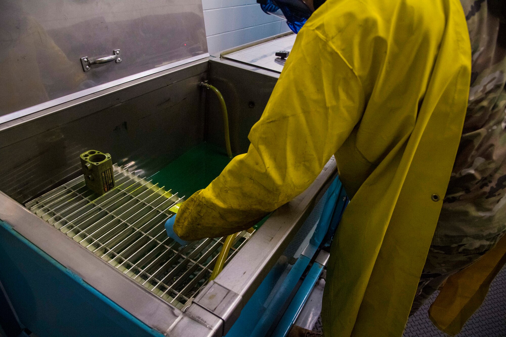 A maintainer with the 6th Maintenance Squadron nondestructive inspections unit applies liquid penetrant to aircraft parts at MacDill Air Force Base, Florida, June 4, 2021.