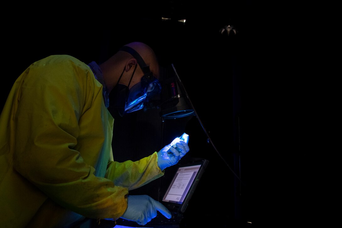 A maintainer with the 6th Maintenance Squadron nondestructive inspections (NDI) unit examines an aircraft part at MacDill Air Force Base, Florida, June 4, 2021.