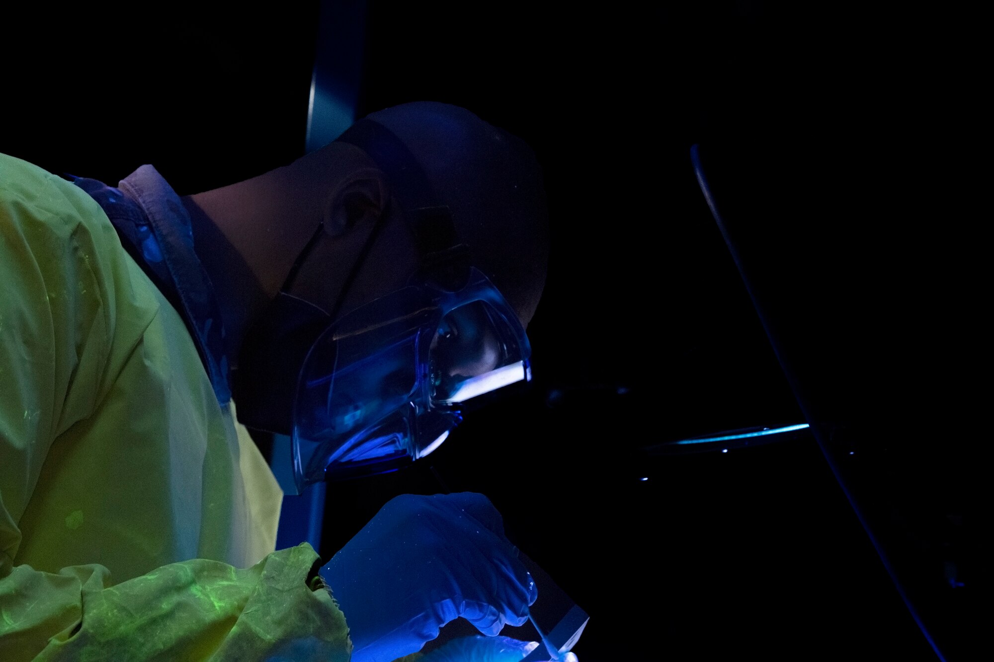 A maintainer with the 6th Maintenance Squadron nondestructive inspections (NDI) unit examines an aircraft part at MacDill Air Force Base, Florida, June 4, 2021.