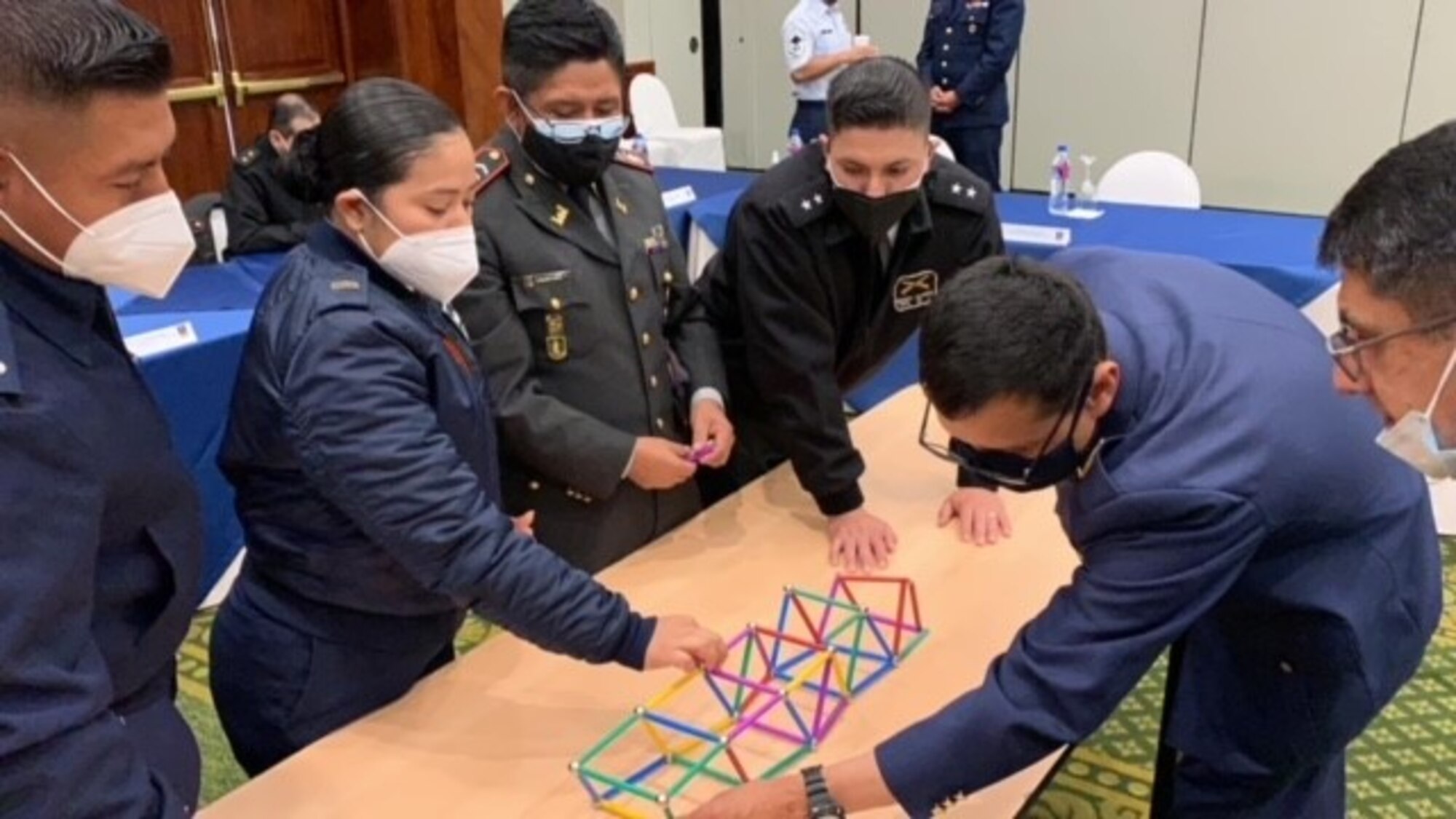 Students build bridge on table.