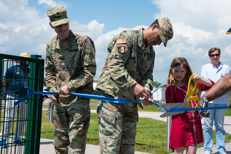 A ribbon-cutting ceremony at the new multi-purpose sports turf field located at Clay North.