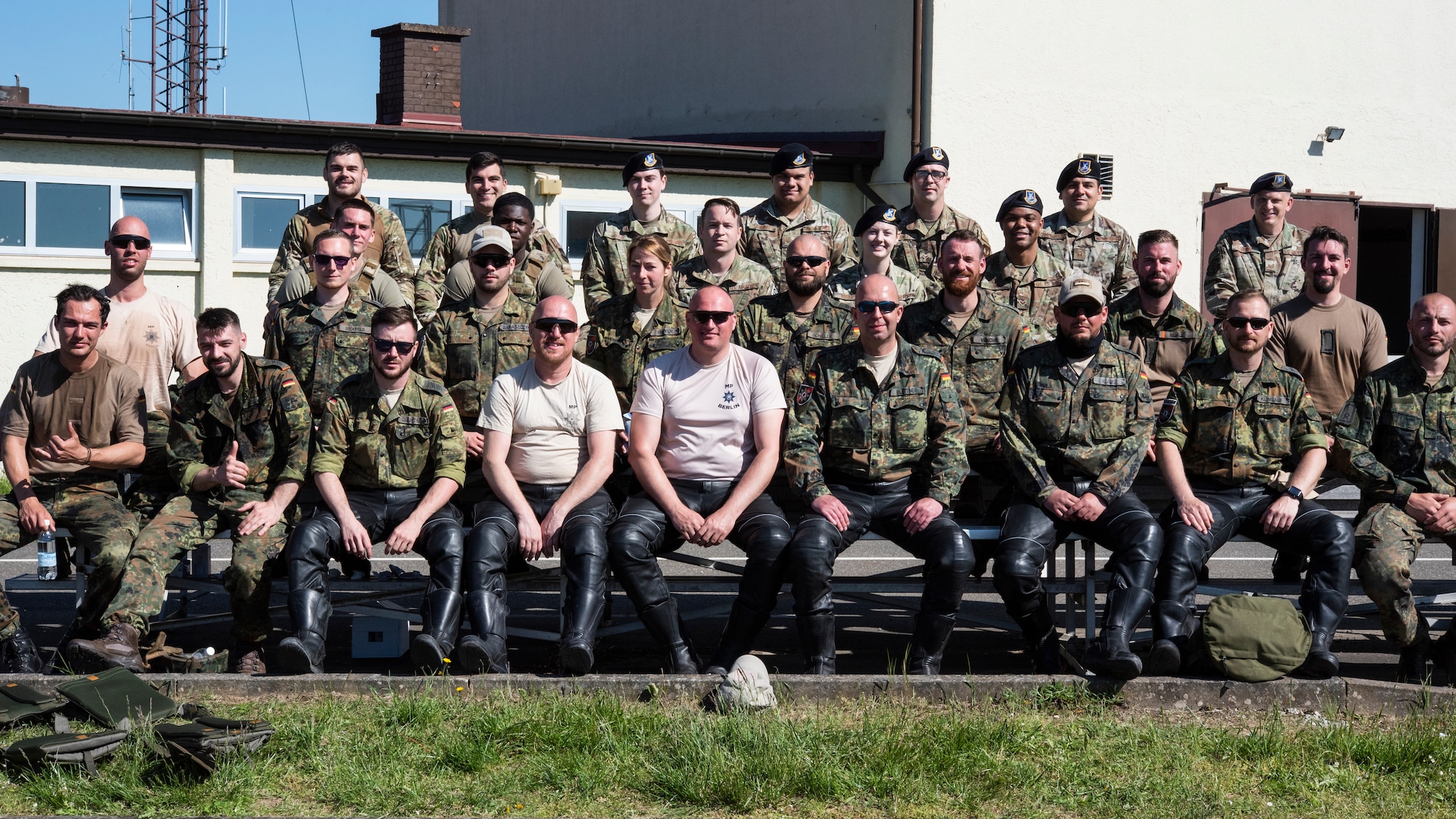 U.S. Air Force Airmen from the 52nd Security Forces Squadron and military police assigned to Germany’s Feldjäger Regiments 1 and 2 sit for a group photo at Spangdahlem Air Base, Germany, June 2, 2021.