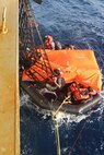 210608-N-N0748-1002 GULF OF ADEN (June 8, 2021) - Crew members of a motor vessel Falcon Line climb aboard the Military Sealift Command (MSC) fleet replenishment oiler USNS Patuxent (T-AO 201) during rescue operations in the Gulf of Aden, June 8. Patuxent is deployed to the U.S. 5th Fleet area of operations in support of naval operations to ensure maritime stability and security in the Central Region, connecting the Mediterranean and Pacific through the western Indian Ocean and three strategic choke points. (U.S. Navy photo)