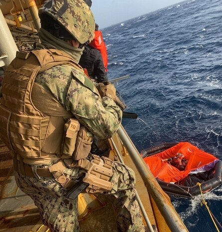 210608-N-N0748-1010 GULF OF ADEN (June 8, 2021) – Master-at-Arms 2nd Class Michael Garcia, assigned to Embarked Security Intelligence Team 11, deployed with Commander, Task Force (CTF) 56, aboard the Military Sealift Command fleet replenishment oiler USNS Patuxent (T-AO 201), relays information on a radio during rescue operations for the crew members of a motor vessel Falcon Line, which sank in the Gulf of Aden, June 8. Patuxent is deployed to the U.S. 5th Fleet area of operations in support of naval operations to ensure maritime stability and security in the Central Region, connecting the Mediterranean and Pacific through the western Indian Ocean and three strategic choke points. (U.S. Navy photo by Electronics Technician 3rd Class Joshua Mazon)