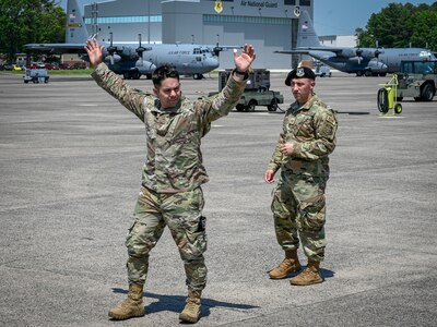 Tech. Sgt. Leo Otero, left, and Staff Sgt. Daniel Vanwormer, 103rd Security Forces Squadron, demonstrate detaining procedures during a training course on flight line security for the 103rd Maintenance Group at Bradley Air National Guard Base, East Granby, Connecticut, June 5, 2021. The course taught maintainers techniques for bolstering security, responding to potential threats before Security Forces personnel arrive.