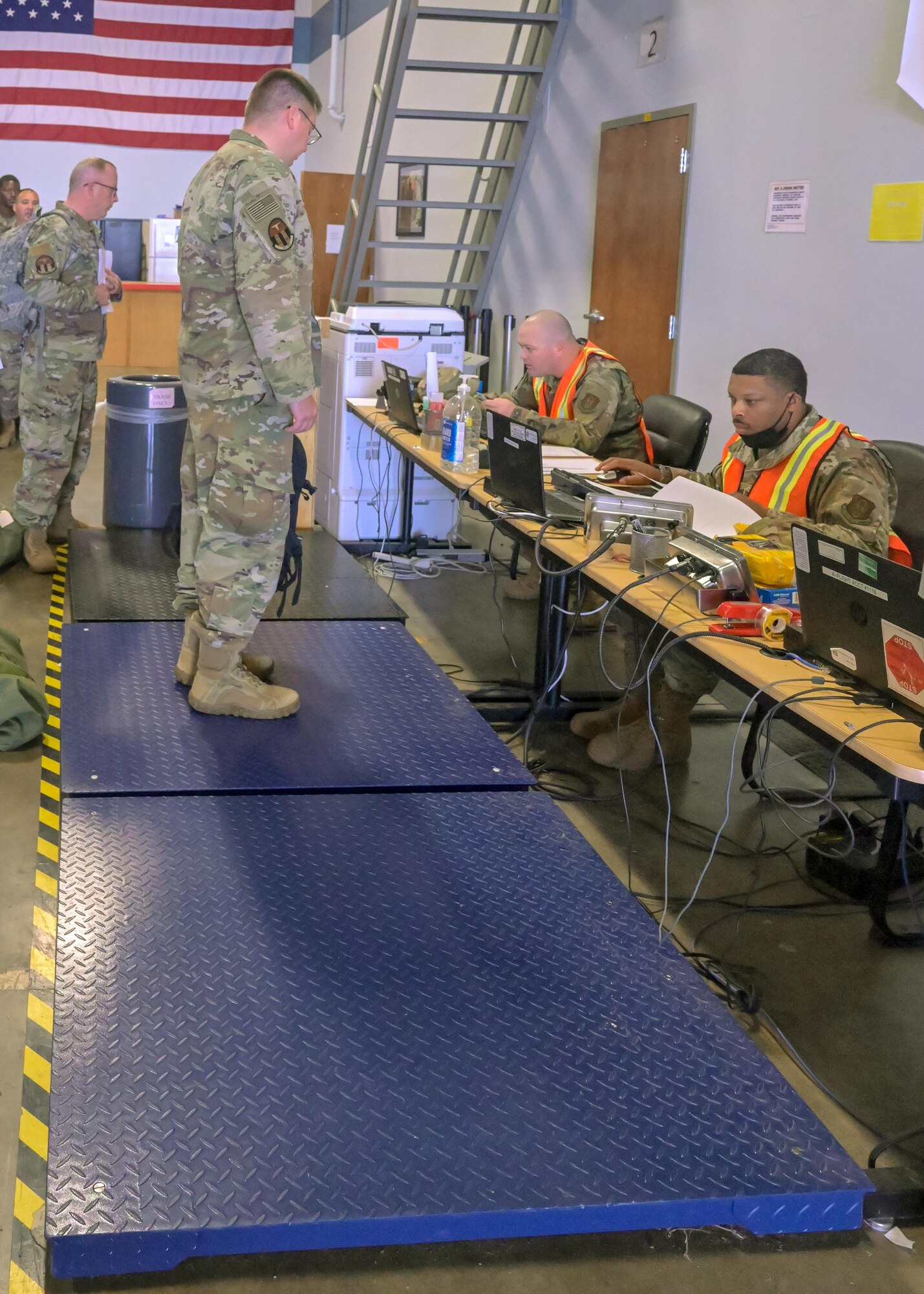 U.S. Air Force Reserve air transportation specialist weigh Airmen and process a flight manifest during the phase 1 deployment exercise June 6, 2021, at Little Rock Air Force Base, Arkansas. The event tested predeployment administrative processes and will identify areas of improvement before a real world deployment. (U.S. Air Force photo by Maj. Ashley Walker)