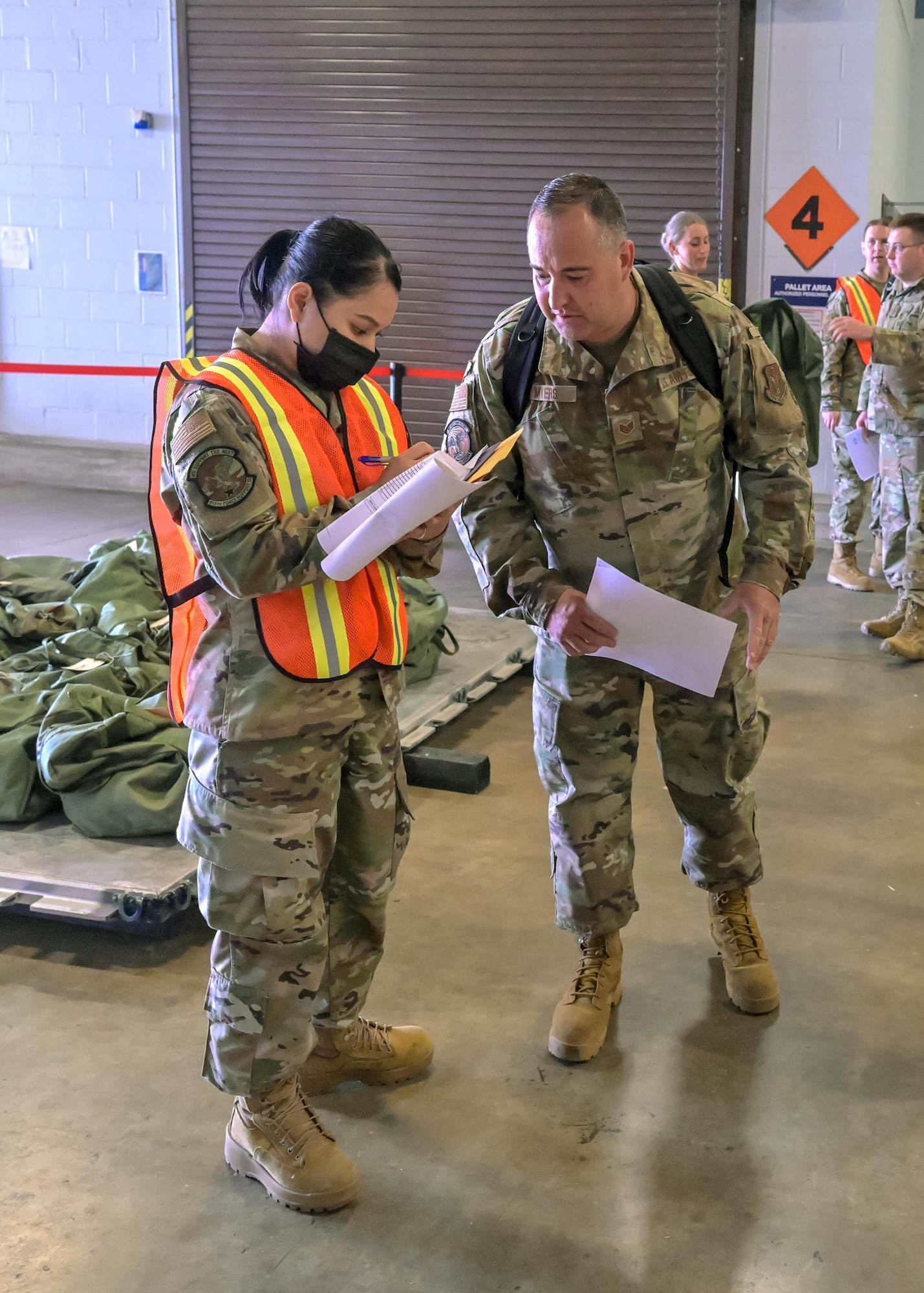 U.S. Air Force Reserve Airmen from the 913th Airlift Group process through the predeployment function line of the phase 1 deployment exercise June 6, 2021, at Little Rock Air Force Base, Arkansas. The event tested predeployment administrative processes and will identify areas of improvement before a real world deployment. (U.S. Air Force photo by Maj. Ashley Walker)