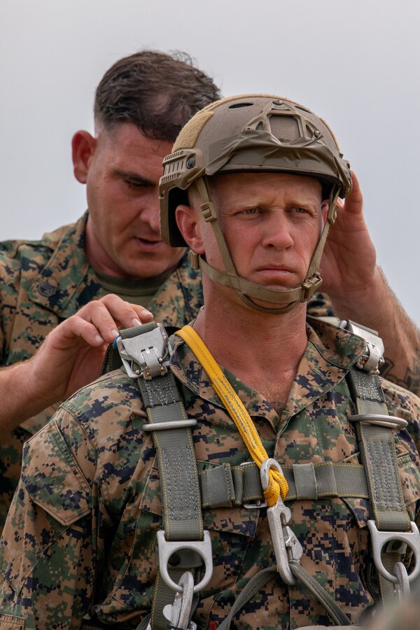 Marines with 3rd Force Reconnaissance Company, 4th Marine Division, prepare for freefall and low level static line jump training at Camp Shelby, Mississippi, on June 3, 2021. The purpose of this exercise is to reinforce the Marines' technique and proficiency on air to ground insertion in order to achieve unit readiness for rapid deployment. (U.S. Marine Corps photo by Lance Cpl. David Intriago)