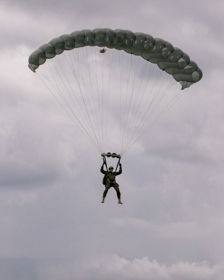 Marines with 3rd Force Reconnaissance Company, 4th Marine Division, conduct freefall and low level static line jumps at Camp Shelby, Mississippi, on June 3, 2021. The purpose of this exercise is to reinforce the Marines' technique and proficiency on air to ground insertion in order to achieve unit readiness for rapid deployment. (U.S. Marine Corps photo by Lance Cpl. David Intriago)