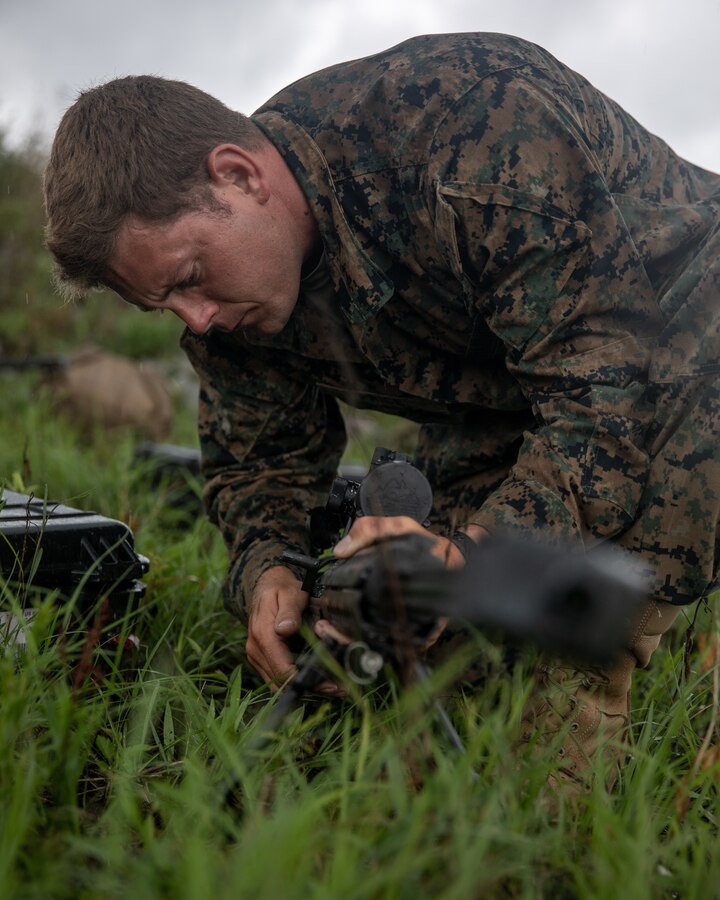 A Marine with 3rd Force Reconnaissance Company, 4th Marine Division, assembles his rifle during sniper training at Camp Shelby, Mississippi, on June 6, 2021. The Marines trained with the M107 semi-automatic long-range sniper rifle, an anti-materiel rifle that fires .50 caliber ammunition out to a maximum effective range of 2000 meters. (U.S. Marine Corps photo by Lance Cpl. David Intriago)