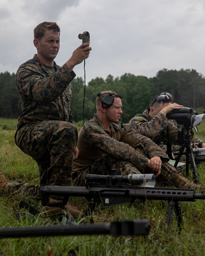 Marines with 3rd Force Reconnaissance Company, 4th Marine Division, prepare their equipment during sniper training at Camp Shelby, Mississippi, on June 6, 2021. The Marines trained with the M107 semi-automatic long-range sniper rifle, an anti-materiel rifle that fires .50 caliber ammunition out to a maximum effective range of 2000 meters. (U.S. Marine Corps photo by Lance Cpl. David Intriago)