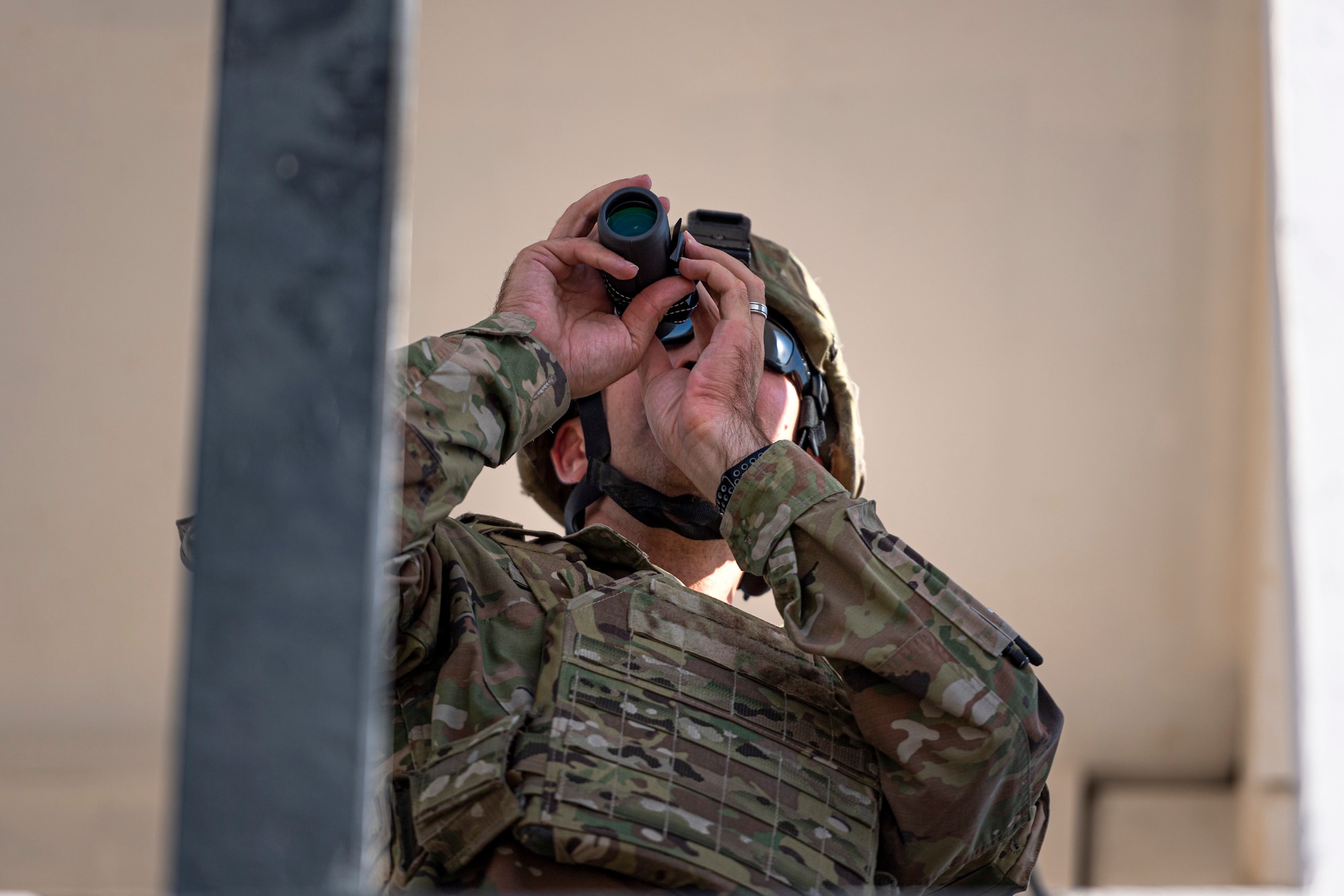 A photo of an Airman looking over a range