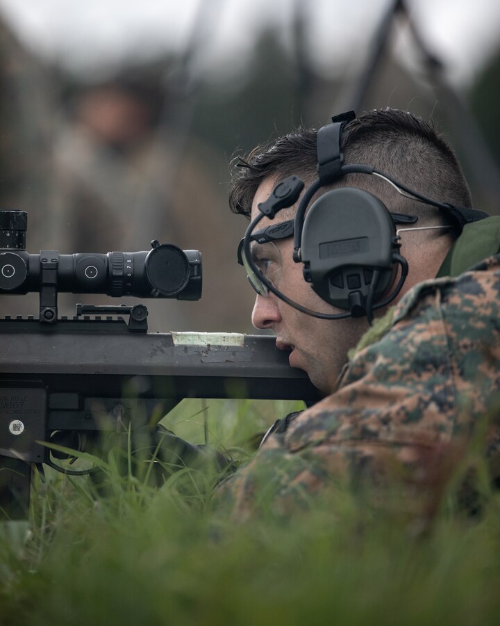 A Marine with 3rd Force Reconnaissance Company, 4th Marine Division, aims down range during sniper training at Camp Shelby, Mississippi, on June 6, 2021. The Marines trained with the M107 semi-automatic long-range sniper rifle, an anti-materiel rifle that fires .50 caliber ammunition out to a maximum effective range of 2000 meters. (U.S. Marine Corps photo by Lance Cpl. David Intriago)