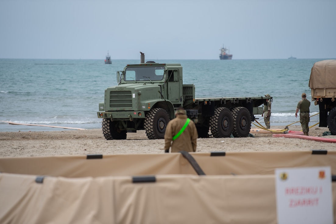 Soldiers from the 493rd Petroleum Support Company transfer fuel from vessel to shore as part of Over-the -Shore Operations in support of Defender Europe 21, near Port of Durres, Albania, May 3.