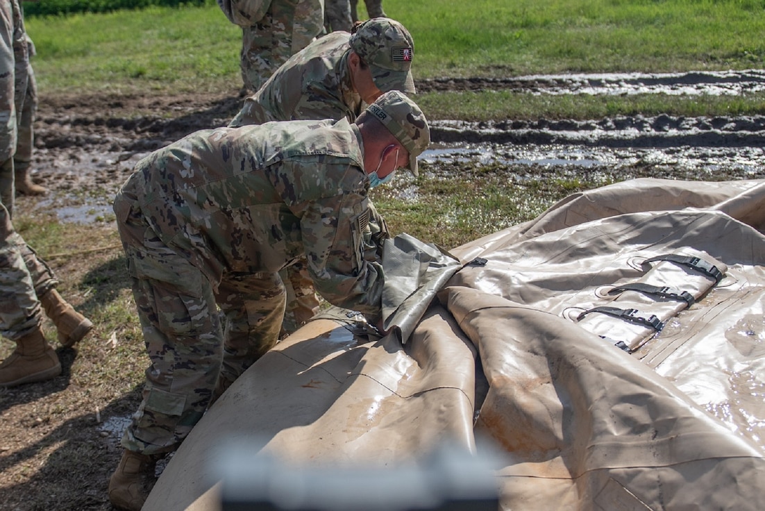 Soldiers from the 240th Composite Supply Company conduct water purification and laundry operations in support of Defender Europe 21, at Papa, Hungary, May 10.