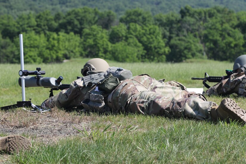 Two service members from the Pennsylvania National Guard work through one of the events during the Adjutant General's Combined-Arms Match June 5, 2021, at Fort Indiantown Gap, Pa.