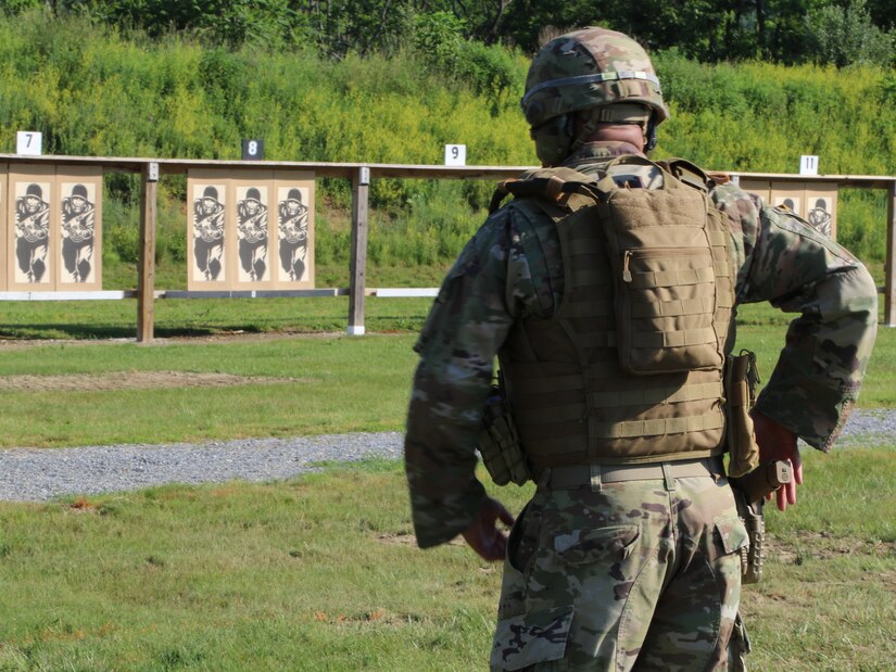 A service member prepares to draw his M-17 pistol during the Adjutant General's Combined-Arms Match June 6, 2021, at Fort Indiantown Gap, Pa.