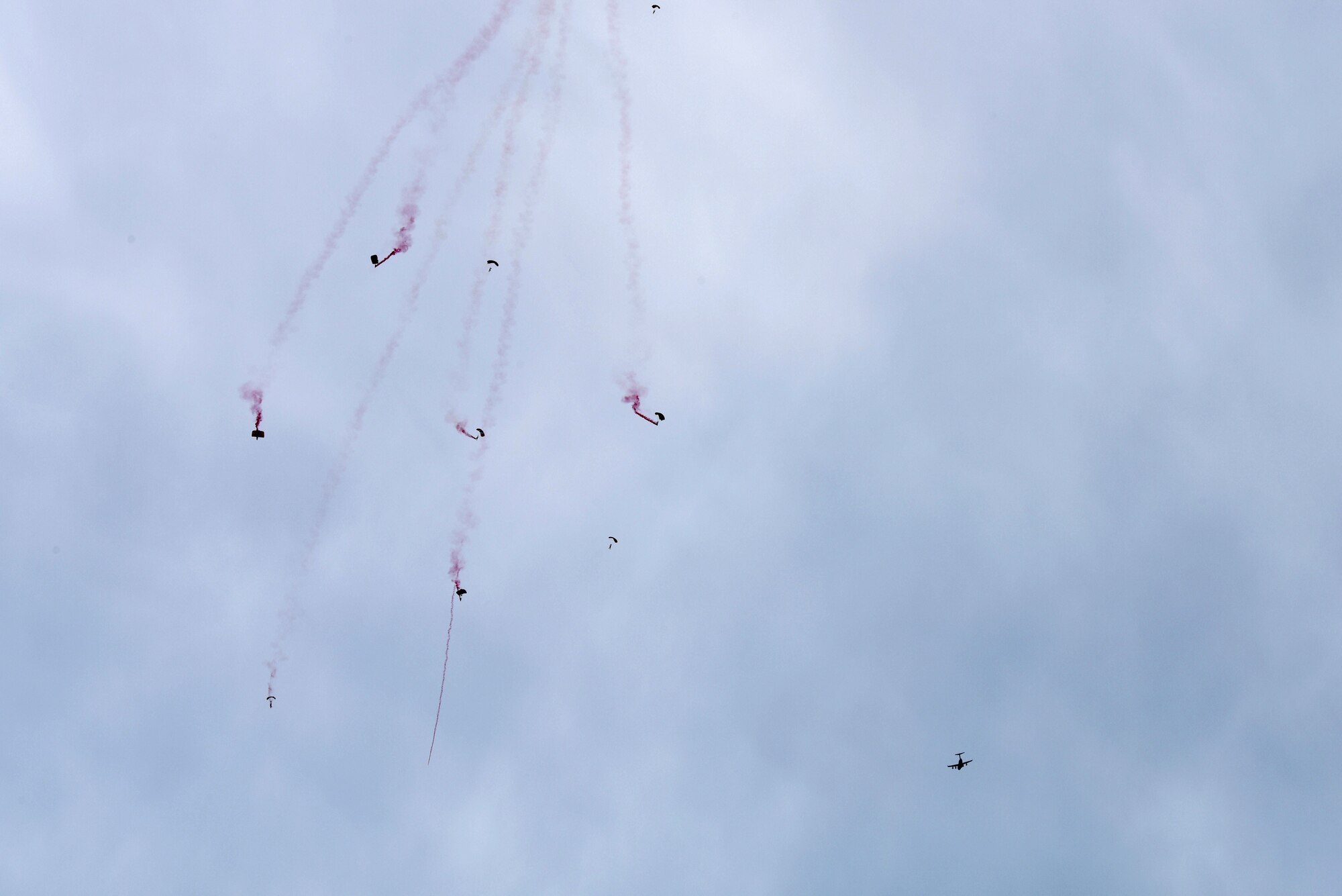 The British Army Red Devils Army Display Team begins their demonstration above Miami Beach, Florida, after parachuting out of a C-17 Globemaster III piloted by the C-17 West Coast Demo Team from Joint Base Lewis-McChord, Washington, May 30, 2021. Air shows give the Demo Team the opportunity to showcase the abilities of the aircraft that are used on a global scale to succeed in the airlift mission. (U.S. Air Force photo by Senior Airman Mikayla Heineck)