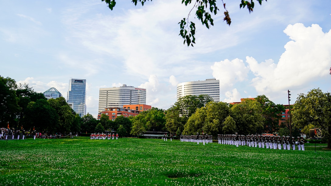 Marines with Marine Barracks Washington stand in formation during a Tuesday Sunset Parade at the Marine Corps War Memorial, Arlington, Va., June 8, 2021. The hosting official for the evening was Mr. Robert D. Hogue, counsel for the Commandant of the Marine Corps, and The Honorable Kirsten E. Gillibrand, U.S. Senator for New York, was the guest of honor. (U.S. Marine Corps photo by Sgt. Jason Kolela)