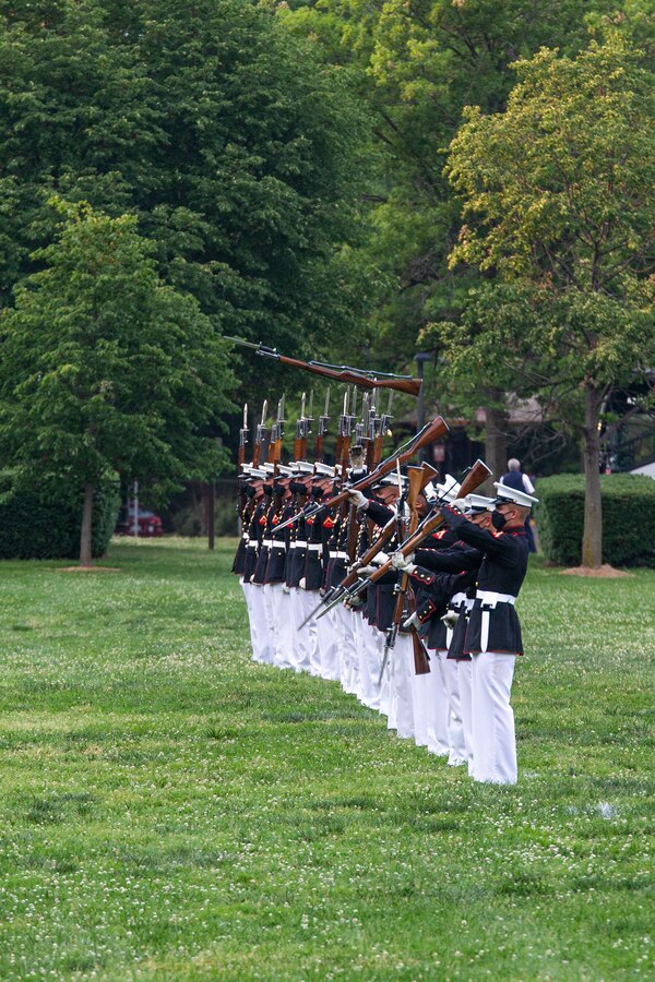 Marines with the Silent Drill Platoon perform their “long line” sequence during a Tuesday Sunset Parade at the Marine Corps War Memorial, Arlington, Va., June 8, 2021. The hosting official for the evening was Mr. Robert D. Hogue, counsel for the Commandant of the Marine Corps, and The Honorable Kirsten E. Gillibrand, U.S. Senator for New York, was the guest of honor. (U.S. Marine Corps photo by Lance Cpl. Mark Morales)