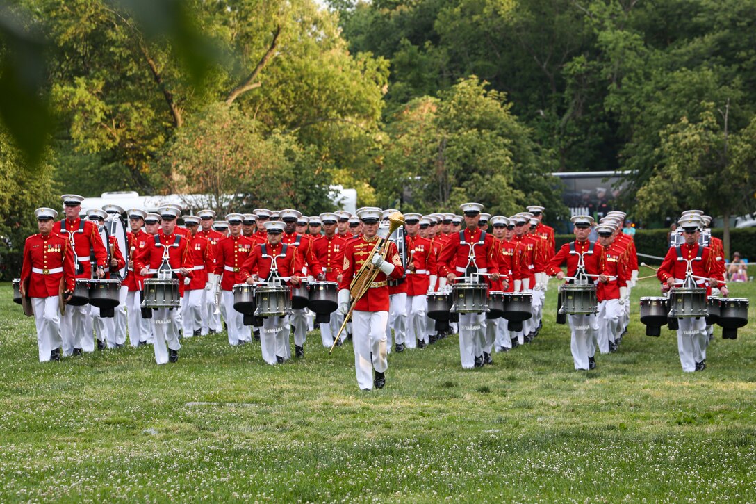 Marines with “The Commandant’s Own,” U.S. Marine Drum and Bugle Corps, perform during a Tuesday Sunset Parade at the Marine Corps War Memorial, Arlington, Va., June 8, 2021. The hosting official for the evening was Mr. Robert D. Hogue, counsel for the Commandant of the Marine Corps, and The Honorable Kirsten E. Gillibrand, U.S. Senator for New York, was the guest of honor. (U.S. Marine Corps photo by Lance Cpl. Allen Sanders)