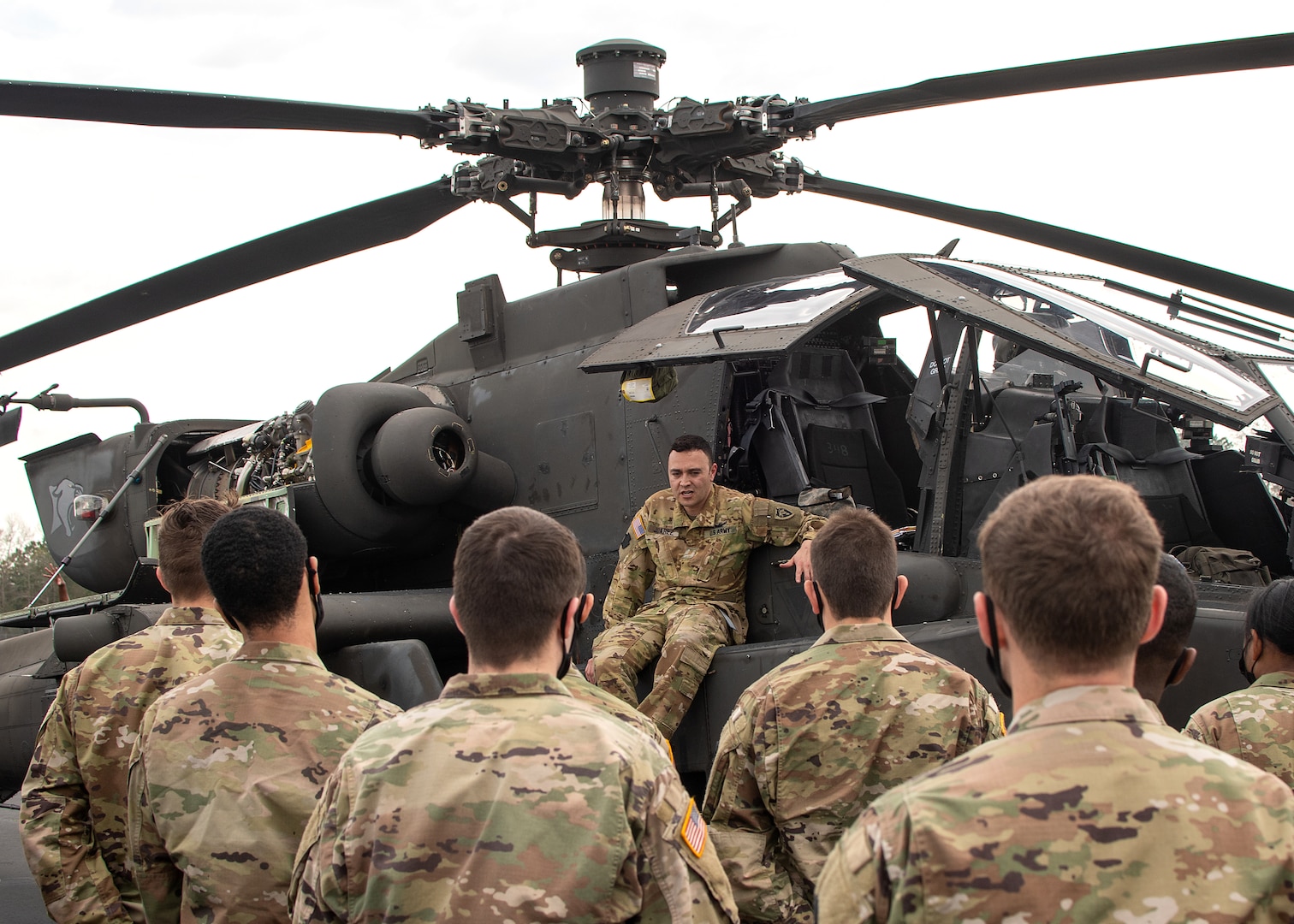 Maj. Eric Juarez, a helicopter pilot with the 449th Combat Aviation Brigade, North Carolina Army National Guard, speaks with ROTC cadets from East Carolina University during an ROTC training event in Greenville, North Carolina. Army National Guard members interested in commissioning through ROTC may also qualify for the Army National Guard ROTC Minuteman Scholarship, a program administered through the U.S. Army Cadet Command that pays full tuition and other education expenses for Army Guard members enrolled in an Army ROTC program.