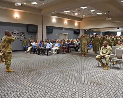 Members of the 17th Medical Group salute Col. Derek Larbie, 17th MDG incoming commander, during the change of command ceremony at the Event Center on Goodfellow Air Force Base, Texas, June 8, 2021. The salute from members of the 17th MDG formally welcomes Larbie in his assumption of command. (U.S. Air Force photo by Senior Airman Abbey Rieves)