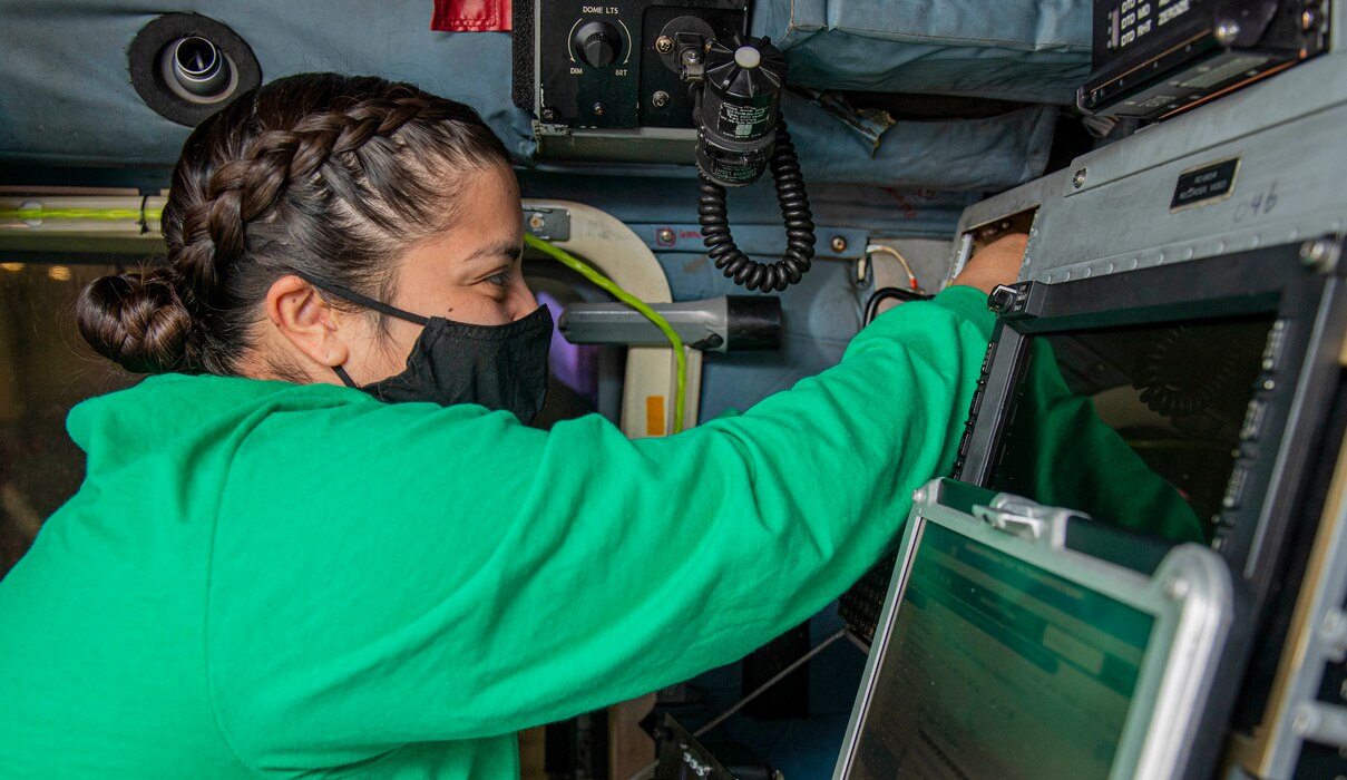 Aviation Electronics Technician 2nd Class Olivia Ontiveros, from Kennewick, Washington, uses a ratchet to remove an avionics rack on an MH-60R Sea Hawk helicopter, attached to the "Proud Warriors" of Helicopter Maritime Strike Squadron (HSM) 72, in the hangar bay of the Nimitz-class aircraft carrier USS Harry S. Truman (CVN 75) as part of the Tailored Ship's Training Availability (TSTA) and Final Evaluation Problem (FEP).