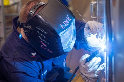 Hull Maintenance Technician 3rd Class Alex Link, from Collinsville, Illinois, welds a cabinet in the bakery aboard the Nimitz-class aircraft carrier USS Harry S. Truman (CVN 75) during Tailored Ship's Training Availability (TSTA) and Final Evaluation Problem (FEP).