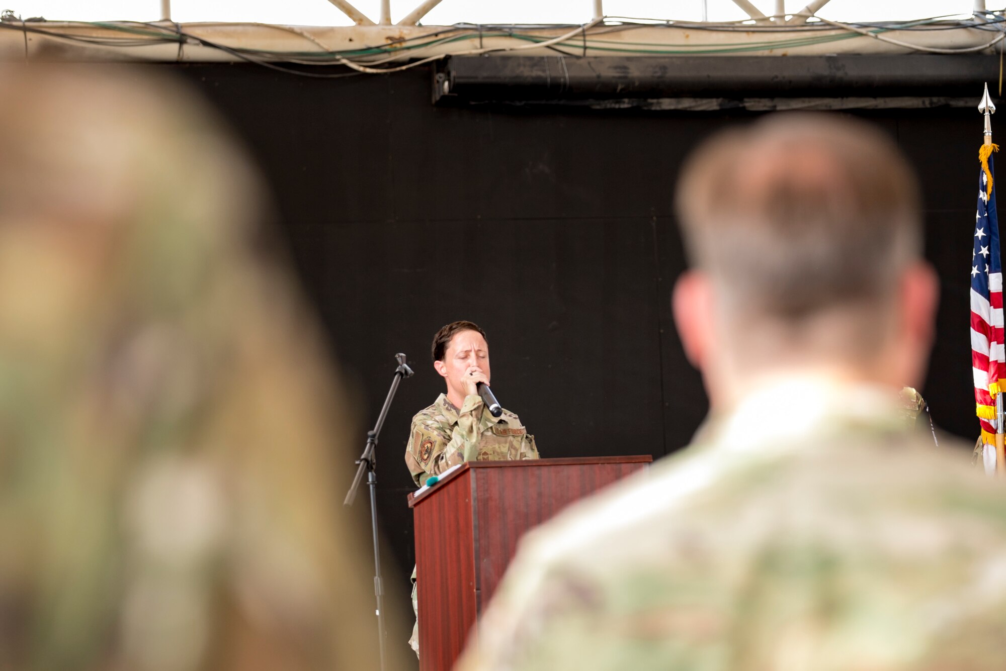 U.S. Air Force Brig. Gen. Larry Broadwell, outgoing commander, passes command of the 380th Air Expeditionary Wing to Brig. Gen. Andrew Clark, incoming commander, during a change of command ceremony at Al Dhafra Air Base, United Arab Emirates, June 8, 2021. The change of command ceremony is a military tradition that represents a formal transfer of authority and responsibility for a unit from one commanding officer to another.