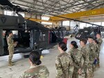 A U.S. Army warrant officer briefs U.S. Air Force Academy cadets about the flight capabilities of a UH-60 Blackhawk helicopter at Martindale Army Airfield, San Antonio, Texas, May 28, 2021.