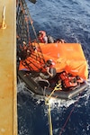 210608-N-N0748-1002 GULF OF ADEN (June 8, 2021) - Crew members of a motor vessel Falcon Line climb aboard the Military Sealift Command (MSC) fleet replenishment oiler USNS Patuxent (T-AO 201) during rescue operations in the Gulf of Aden, June 8. Patuxent is deployed to the U.S. 5th Fleet area of operations in support of naval operations to ensure maritime stability and security in the Central Region, connecting the Mediterranean and Pacific through the western Indian Ocean and three strategic choke points. (U.S. Navy photo)