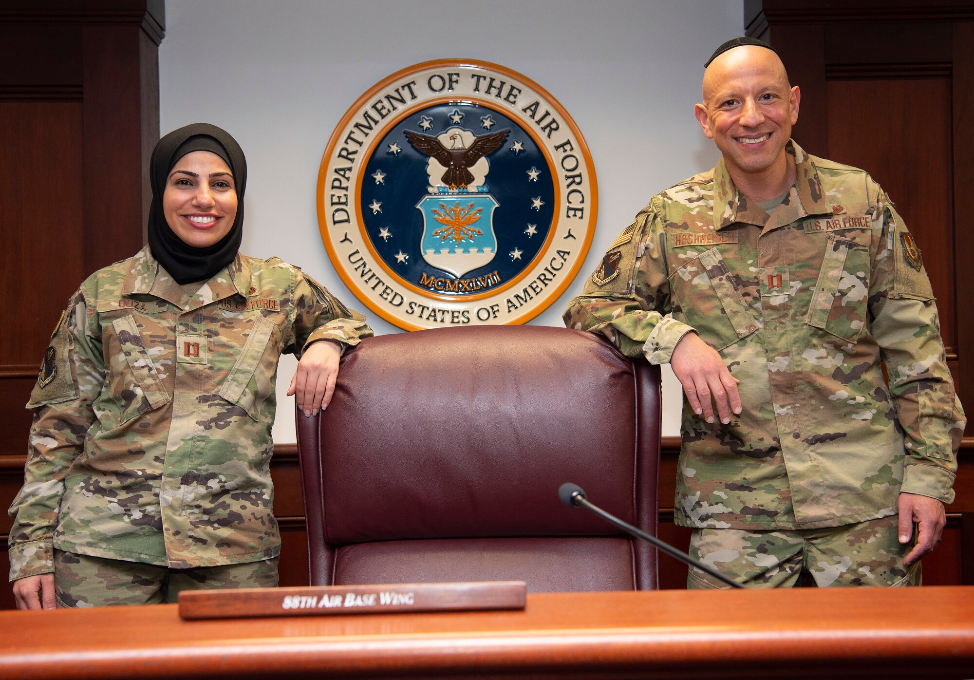 Capt. Maysaa Ouza (left), 88th Air Base Wing chief of adverse actions, and Capt. Yosef Hochheiser, Air Force reservist and 88 ABW assistant staff judge advocate, are pictured in the U.S. courtroom at Wright-Patterson Air Force Base on May 20. Their partnership helped establish the first religious-accommodation rule change for Muslims to wear a hijab in uniform. (US Air Force photo by R.J. Oriez)