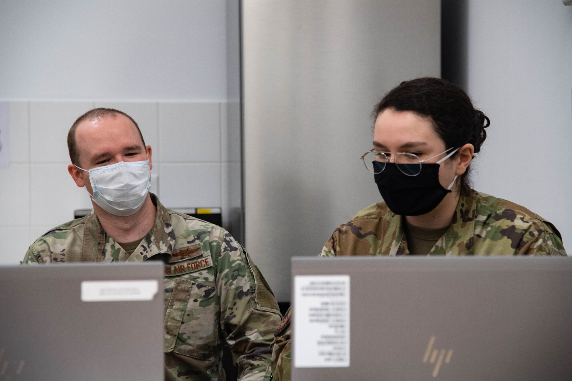 U.S Air Force Capt. Michael Jacobs, deputy branch chief of future operations headquarters United States European Command, discusses with Staff Sgt. Janeace Stampul, 2d Communication Squadron Mission Defense Team technician, about the capabilities of their Mission Assurance Capabilities Kit at Morón Air Base, Spain, June 2, 2021. Mission Defense Teams safeguard data analytics ensuring   weapons systems are safe from adversaries. (U.S. Air Force photo by 2nd Lt Aileen Lauer)