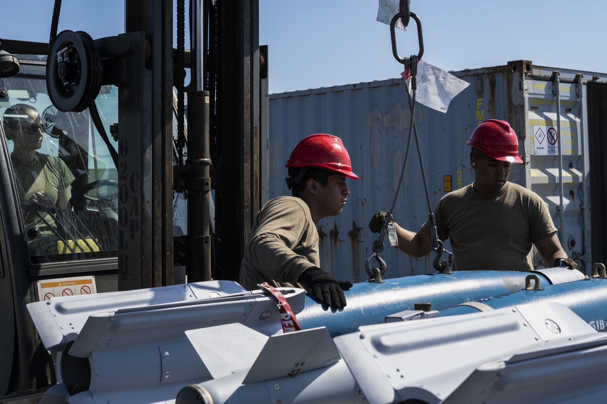 U.S. Air Force Airmen from the 52nd Maintenance Squadron at Spangdahlem Air Base, Germany, load a fully assembled GBU-12 inert bomb used for training at Kallax Air Base, Sweden, June 7, 2021. Airmen working in the ammunitions section of the 52nd MXS play a vital role in assembling ammunition used for the continuous deterrence of enemy forces during exercises such as the Arctic Challenge Exercise 2021. (U.S. Air Force photo by Senior Airman Ali Stewart)