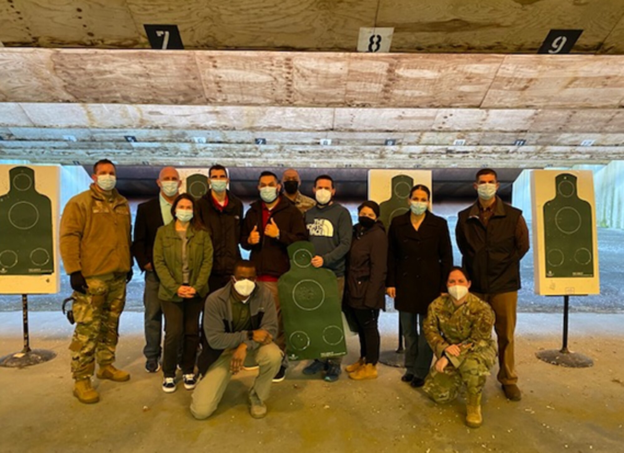 Headquarters U.S. Air Forces in Europe and Air Forces Africa government civilians meet Air Force Office of Special Investigations agents at the firing range on Ramstein Air Base, Germany, May 14, 2021.