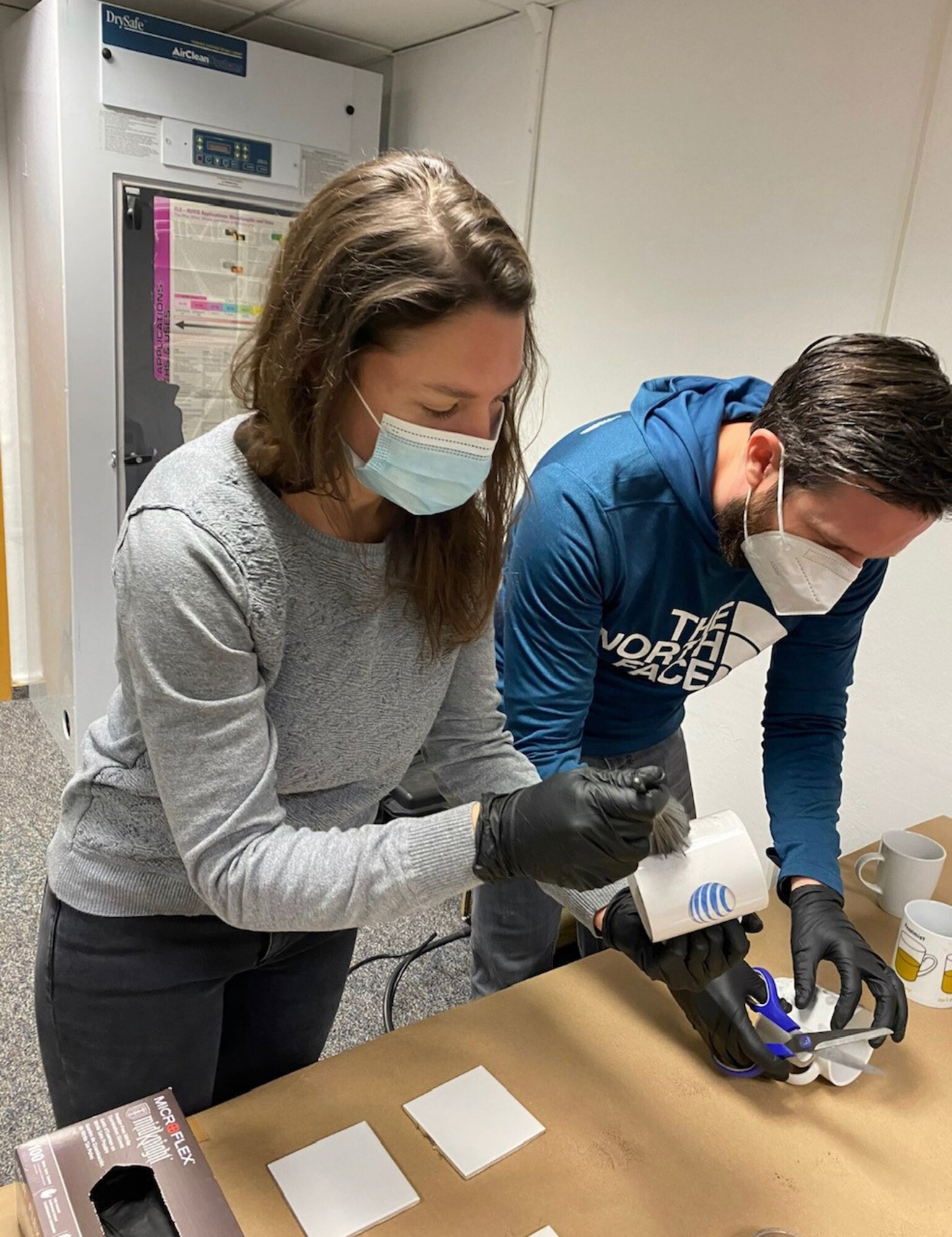 Civilian Leadership Development Program members inspect simulated evidence during an immersion tour with the Air Force Office of Special Investigations Region 5 and 4 Field Investigative Squadron staff at Ramstein Air Base, Germany, May 14, 2021.