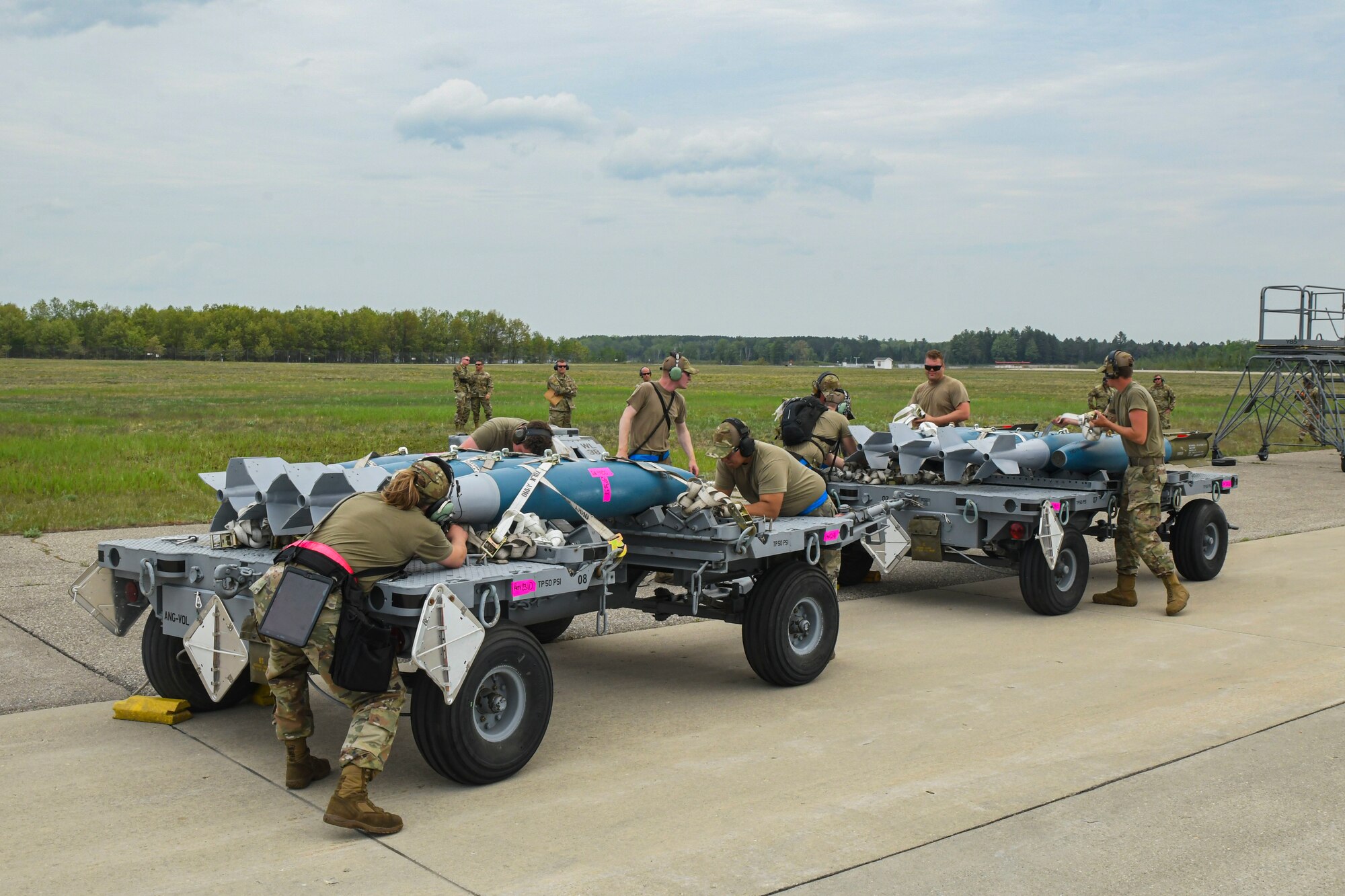 Airmen from the 354th Aircraft Maintenance Unit prepare munitions for integrated combat turns