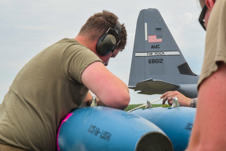 An Airman from the 354th Aircraft Maintenance Unit preps munitions for integrated combat turns