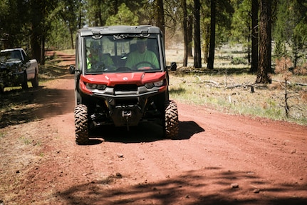 Klamath County search and rescue member drive a side-by-side to search for a simulated missing pilot June 5, 2021, near Gerber Reservoir, Ore. The 173rd Fighter Wing held a joint exercise with the Klamath County SAR team to practice finding a downed pilot in the woods.