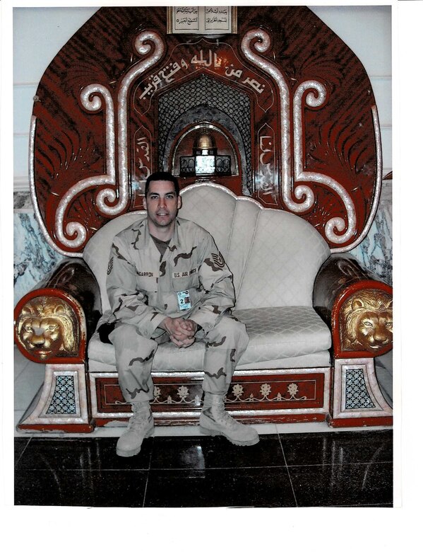 Tech. Sgt. Brady McCarron poses for a photo in 2005 at Saddam Hussein’s Al-Faw Palace in Baghdad, Iraq. McCarron deployed as a public affairs Airman, providing essential visual documentation of the mission and telling the stories of service members throughout Iraq. (Courtesy photo)
