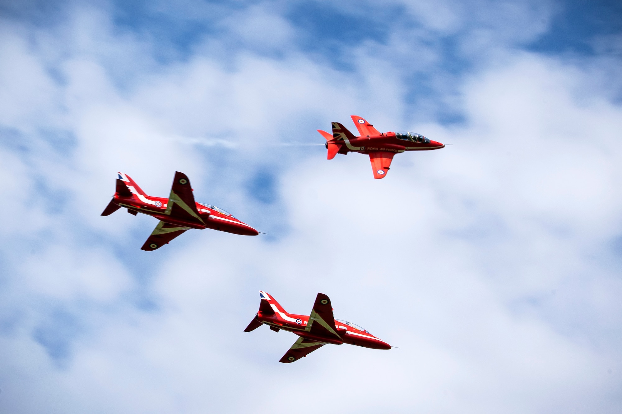 The Royal Air Force aerobatic team, known as the Red Arrows, performs a flyover at RAF Fairford, England, June 4, 2021. The Red Arrows landed at Fairford to refuel in preparation for the Midlands Air Festival. (U.S. Air Force photo by Senior Airman Eugene Oliver)