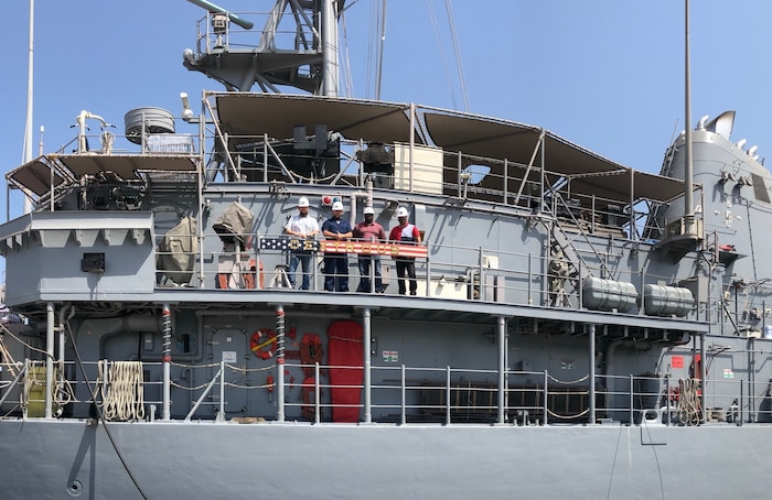 Forward Deployed Regional Maintenance Center (FDRMC) Detachment Bahrain project team stands on the USS Dextrous (MCM 13) after completing her availability 17 days ahead of schedule. Pictured from left to right: Casey Young, Shane Dunn, Paul Crawford, Joseph Deocampo