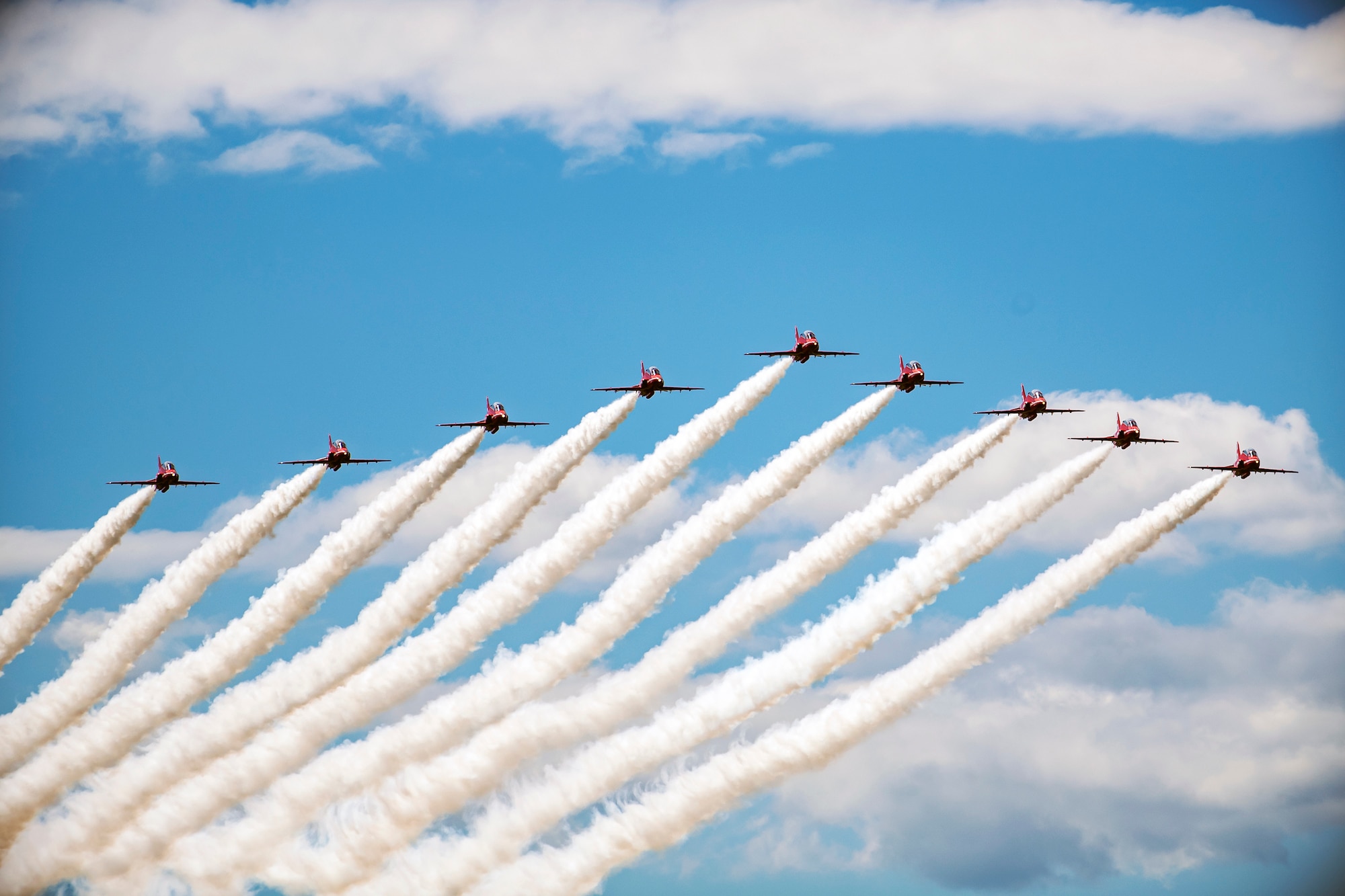 The Royal Air Force Aerobatic team, known as the Red Arrows, fly overhead at RAF Fairford, England, June 4, 2021. The Red Arrows landed at Fairford to refuel in preparation for the Midlands Air Festival. (U.S. Air Force photo by Senior Airman Eugene Oliver)