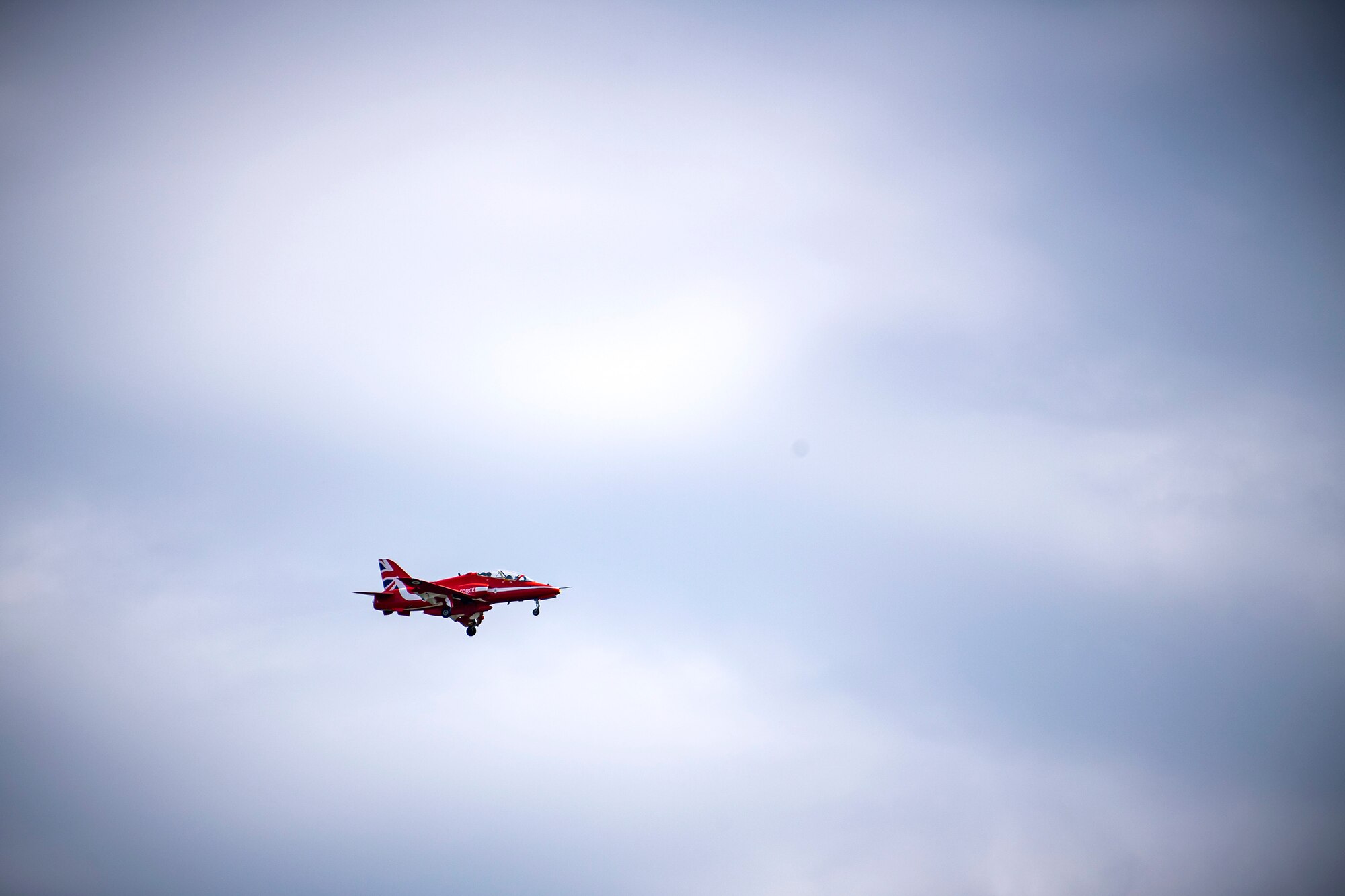 A Hawk T1 aircraft assigned to the Royal Air Force aerobatic team, known as the Red Arrows, flies overhead at RAF Fairford, England, June 4, 2021. The Red Arrows landed at Fairford to refuel in preparation for the Midlands Air Festival. (U.S. Air Force photo by Senior Airman Eugene Oliver)