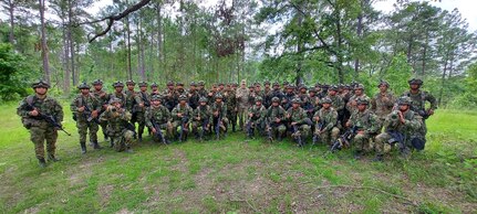 U.S. Army Maj. Gen. Daniel R. Walrath, center-right, commanding general, U.S. Army South, and Colombian Army Maj. Gen. German Lopez Guererro, center-left, Colombian Army Force Generation chief of staff, visit with troops participating in a combined combat training event at the Joint Readiness Training Center, Fort Polk, La., June 9. 

A platoon from the Colombian Army’s Counter Narcotics Brigade is participating in JRTC Rotation 21-08 with members of the U.S. Army South Carolina National Guard’s 1-118th Infantry Battalion to improve interoperability between the U.S. and Colombian armies. The Colombian Army is one of the most professional armies in South America. This opportunity enhances the capabilities and readiness of the U.S. and Colombian Army forces as we continue to develop our mutual readiness.