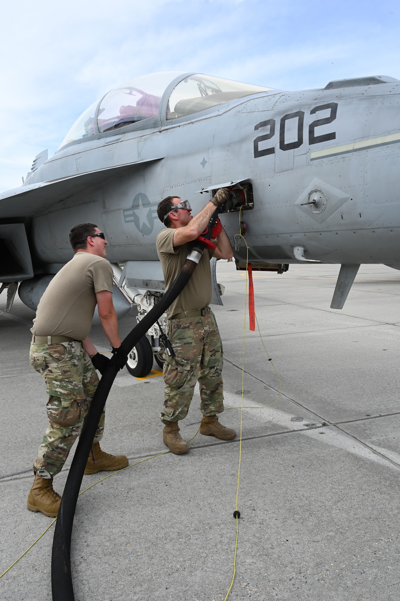 119th Aircraft Maintenance Squadron members refuel a VFA F/A-18 Super Hornet from Naval Air Station Oceana, Va., upon its arrival to participate in Exercise Victory Hooligan at the North Dakota Air National Guard Base, Fargo, N.D., June 7, 2021. (U.S. Air National Guard photo by Chief Master Sgt. David H Lipp)