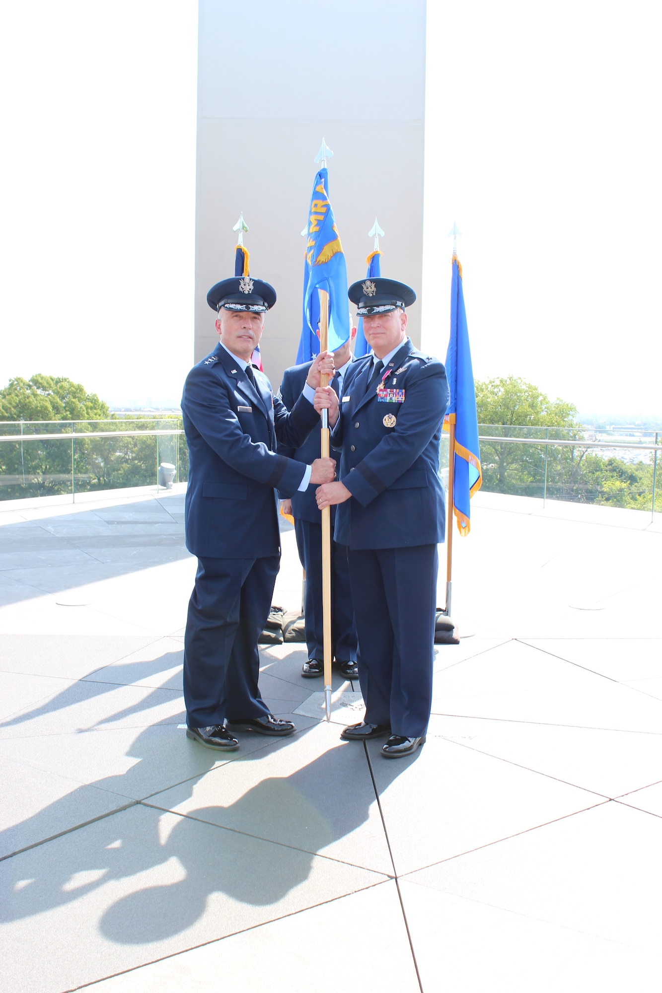 Image of two Airmen holding a guidon.